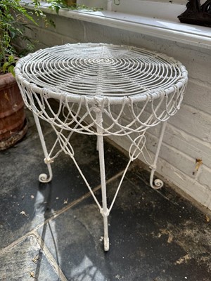 Lot 1957 - Group of white painted wire-work garden furniture comprising two elbow chairs, a standard chair and a low round table (4)