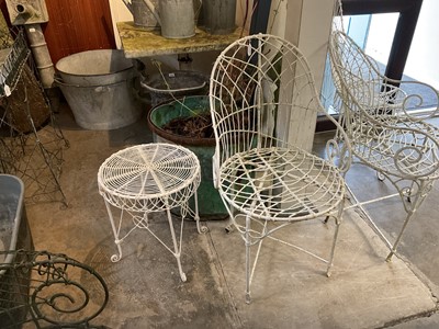 Lot 1957 - Group of white painted wire-work garden furniture comprising two elbow chairs, a standard chair and a low round table (4)