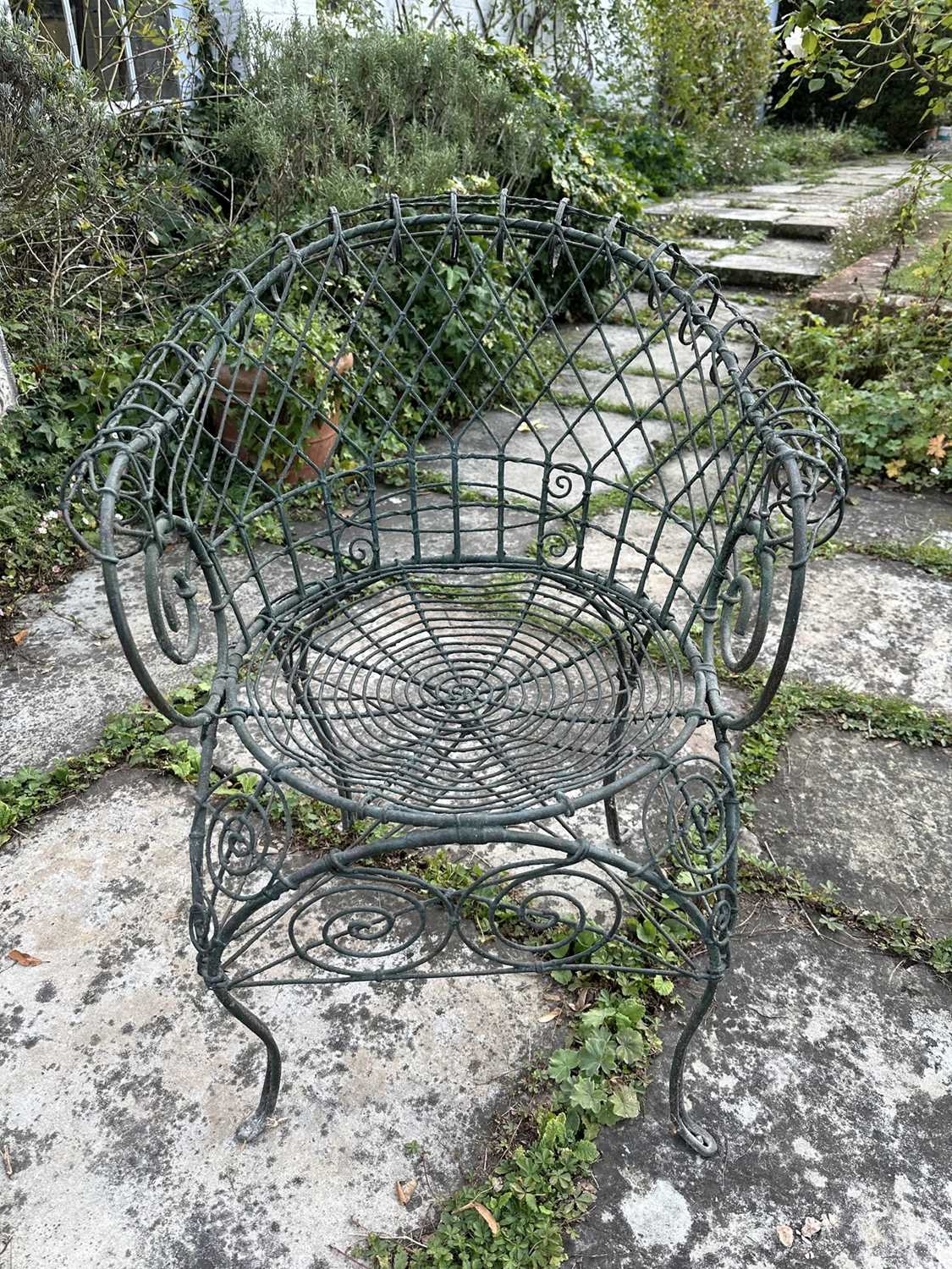 Lot 1958 - Victorian style green wire-work garden chair with scroll supports