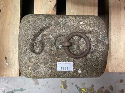 Lot 1961 - Antique granite weight of rectangular tapered form with iron ring handle, 23cm high