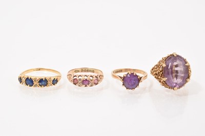 Lot 581 - Four gold dress rings to include Edwardian sapphire and diamond ring, an Edwardian 9ct gold garnet and diamond ring, and two 9ct gold amethyst rings (4)