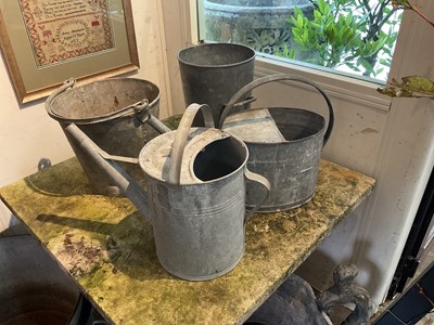 Lot 1965 - Two antique galvanised twin handled planters, galvanised bucket, another and two watering cans (6)