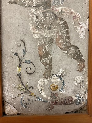 Lot 1879 - Classical probably Roman, painted fresco fragment, depicting a putto pouring wine, approximately 23 x 11cm, in modern pine frame with easel support