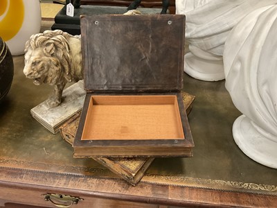 Lot 1882 - Two deceptive book boxes, the 18th century leather bound tomes adapted with internal spaces to hide secrets, largest 29cm high