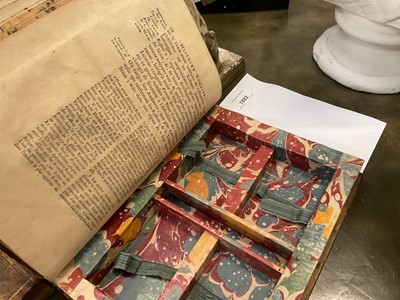 Lot 1882 - Two deceptive book boxes, the 18th century leather bound tomes adapted with internal spaces to hide secrets, largest 29cm high