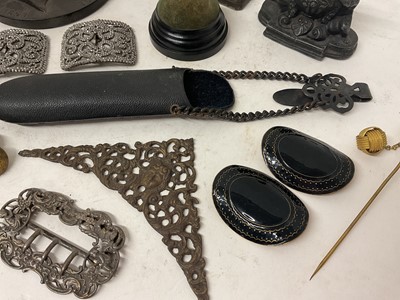 Lot 1884 - Collection of vertu items including buckles, buttons, bois durci plaque, figural inkwell, sculpture etc