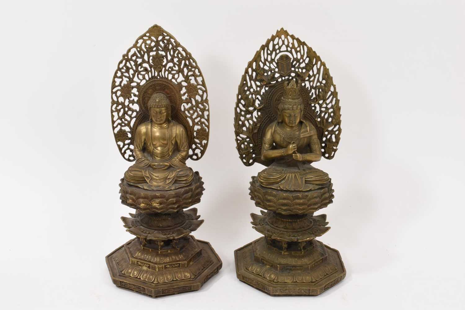 Lot 999 - Pair of Tibetan bronze seated figures
