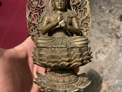Lot 999 - Pair of Tibetan bronze seated figures
