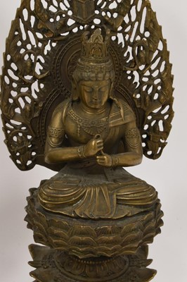 Lot 999 - Pair of Tibetan bronze seated figures