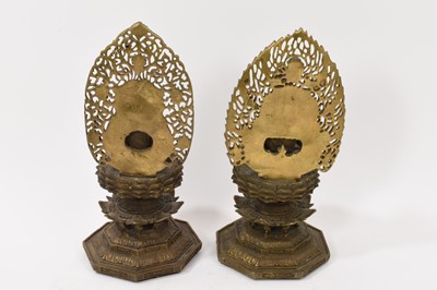 Lot 999 - Pair of Tibetan bronze seated figures