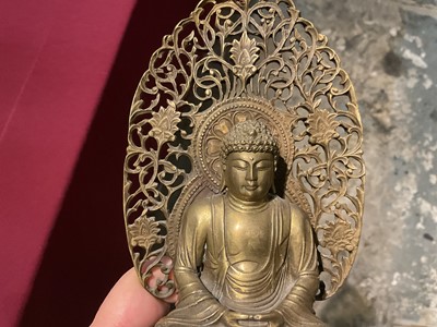 Lot 999 - Pair of Tibetan bronze seated figures