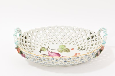 Lot 49 - Chelsea large oval two handled basket, painted with fruits, circa 1760