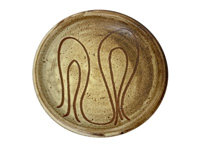 Lot 2372 - Mousehole Pottery dish, with incised abstract design, impressed mouse mark to base, 21.5cm diameter Nb: Mousehole Pottery was established by Bill and Biddy Picard in 1955, after encourag...