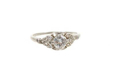 Lot 566 - Art Deco diamonds and platinum single stone 'Orange blossom' ring, in antique bakelite heart shaped box