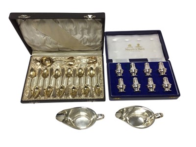 Lot 414 - Set of twelve German silver gilt teaspoons with tea strainer and tongs in fitted case, etc.