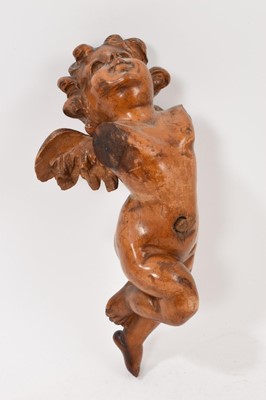 Lot 933 - 19th century Continental carved pine cherub