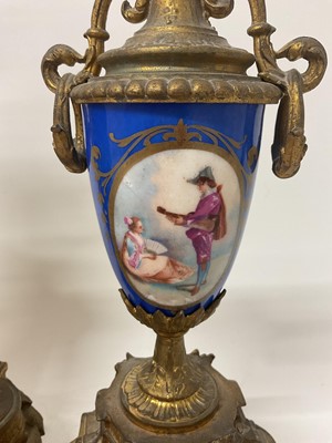 Lot 823 - Late 19th century French gilt metal and porcelain mounted clock garniture