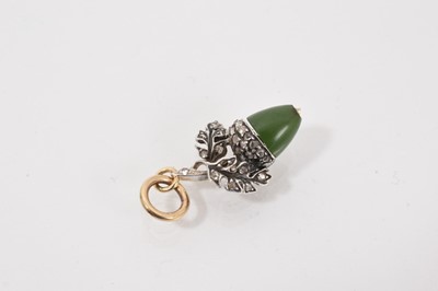 Lot 735 - Diamond and nephrite acorn pendant with a polished nephrite nut and white metal leaves set with rose cut diamonds, 26mm