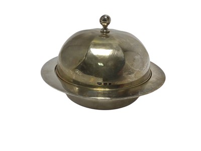 Lot 432 - George V silver muffin dish of circular form with faceted decoration and knop, the underside with engraved presentation inscription, (Sheffield 1931), maker Roberts & Belk, 18.5cm in diamete...