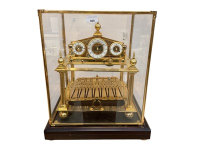 Lot 809 - Impressive Chinese Congreve-style rolling ball clock with enamel dials in glazed brass framed case 49 x 37 x 37 cm with key
