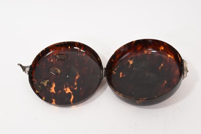 Lot 841 - Early tortoiseshell and silver mounted table snuff box, of domed form with central boss and ornate lock, elaborate old repair to the cover, probably late 17th/early 18th century, 13cm diameter