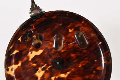 Lot 841 - Early tortoiseshell and silver mounted table snuff box, of domed form with central boss and ornate lock, elaborate old repair to the cover, probably late 17th/early 18th century, 13cm diameter