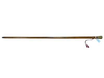 Lot 2994 - Early 19th century “Dandy’s” walking cane with Malacca shaft and gilt metal pommel, with embossed Rococo decoration, with scrolls and reclining females, wrist strap eyelets. 150cm over...