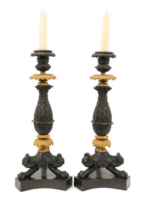 Lot 810 - Pair of Regency bronze and ormolu candlesticks