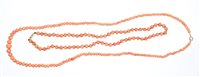 Lot 562 - Two old coral bead necklaces - one with...