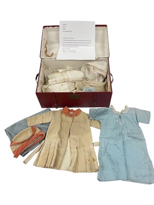Lot 86 - The Rt. Hon. Earl and Countess Spencer, red domed top trunk of small proportions containing dolls clothes, possibly played with by Lady Diana
