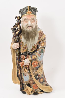 Lot 32 - Large antique Japanese Satsuma figure of an Immortal, brightly decorated, 49cm high