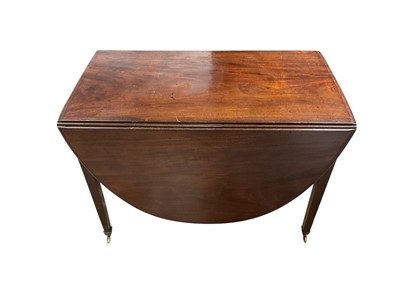 Lot 1456 - 19th century mahogany oval drop-flap dining table, on square taper legs and brass capped castors
