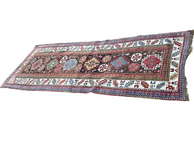 Lot 1486 - Kelim runner with cream borders on red and blue ground