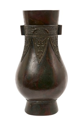 Lot 710 - Antique Chinese hu vase with archaistic relief ornament