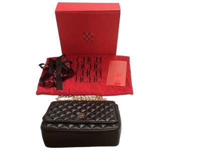 Lot 2531 - Carolina Herrera quilted black lamb skin handbag with CH HC gold tone logo and chain. Boxed with soft dust bag, ribbon and