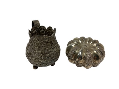 Lot 222 - Late 19th / early 20th century Indian silver cream jug, with all over foliate decoration
