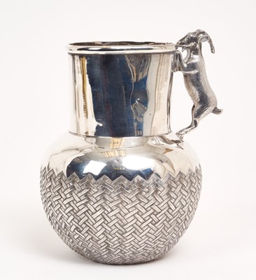Lot 226 - White metal jug with basket work decoration and goat handle, apparently unmarked