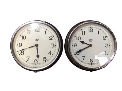 Lot 2949 - Pair of Smiths 8 day clocks both in a Bakelite case, measuring approximately 18cm in diameter, together with a pocket watch stand/case and a dummy pocket watch