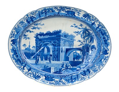 Lot 85 - Early 19th century Spode blue and white oval 'well and tree' platter, printed with the Caramanian Triumphal Arch of Tripoli in Barbary, impressed 'Spode' mark, 52.5cm wide