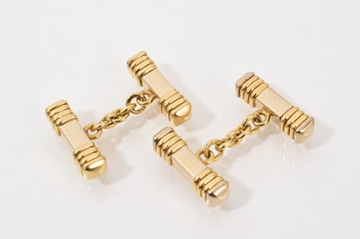 Lot 524 - Pair of white and yellow gold cufflinks with baton shape terminals