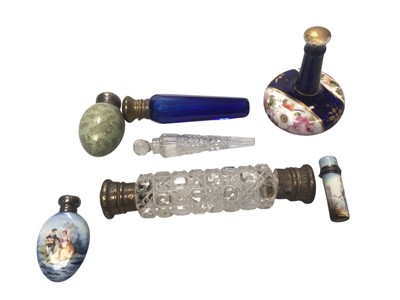 Lot 2903 - Group of glass and porcelain scent bottles, some with silver mounts.
