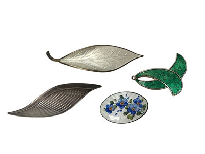 Lot 3 - Four Norwegian silver brooches to include David Andersen white enamel leaf brooch and oval enamel forget-me-not brooch, Karl A. Rasmussen green enamel brooch and one other silver stylised leaf b...