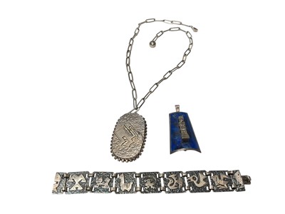Lot 9 - Graziella Laffi (1923-2009) Peruvian silver pendant on chain, lapis lazuli panel with figure pendant/brooch and a panel bracelet depicting various animals and birds (3)