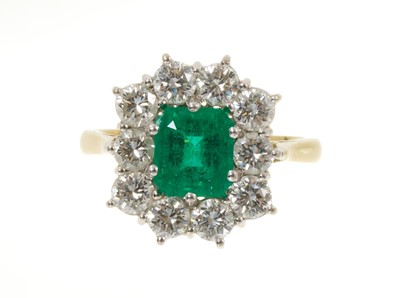 Lot 434 - Emerald and diamond cluster ring with a step cut emerald surrounded by ten brilliant cut diamonds in 18ct gold setting. Estimated total diamond weight approximately 2cts ...