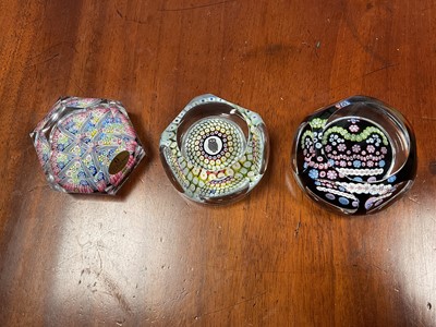 Lot 2206 - Three Whitefriars glass paperweights, including one 1977 commemorative Silver Jubilee, one with an owl in the centre, and one hexagonal millefiori (3)