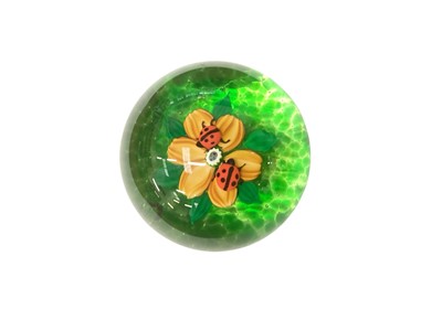 Lot 2207 - William Manson glass lampwork with two ladybirds and a flower (5/150), signed in cane to base