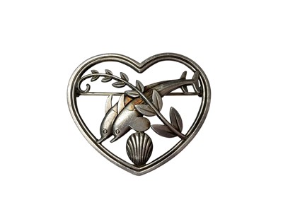 Lot 32 - Georg Jensen Danish sterling silver heart shaped brooch with two dolphins swimming amidst seaweed and a shell, designed by Arno Malinowski, no. 312