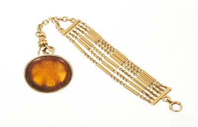 Lot 407 - Georgian gold seal with an intaglio carved carnelian crest on an antique gold six strand fob chain