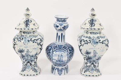 Lot 168 - Pair of Dutch Delft vases and covers, and a Delft style vase