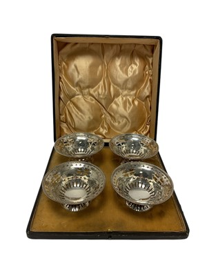 Lot 292 - Set of four Early George V silver dishes of circular form, with pierced decoration 